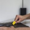 Nimble one-finger cutter opening a black plastic bag
