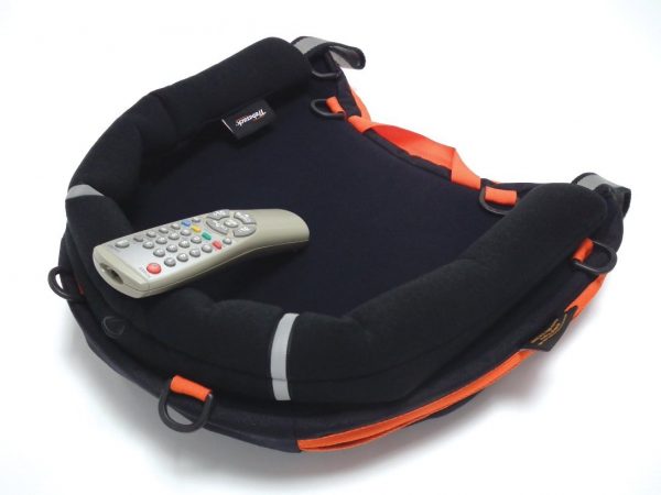 Trabasack Curve Connect wheelchair lap tray and bag with Media Mount supporting a TV handset on top