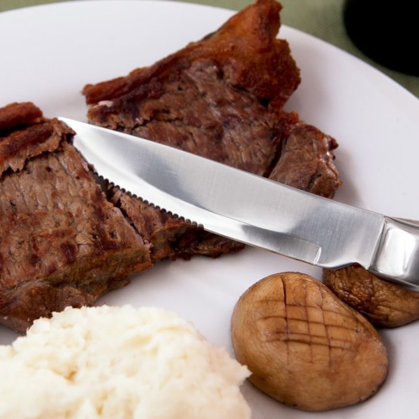 Knork steak knife cutting steak