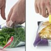 Nimble one-finger cutter being used to open plastic bags