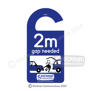 Hanging disabled sign with a cartoon of a stickman unable to get its wheelchair out of the boot without damaging another car parked too close. Text reads: "2m gap needed"