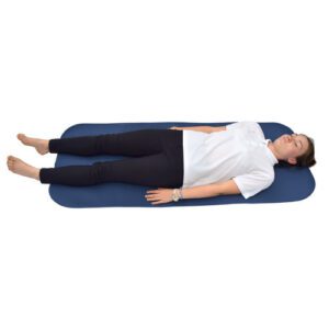 Large changing mat for disabled adults with a woman lying on it