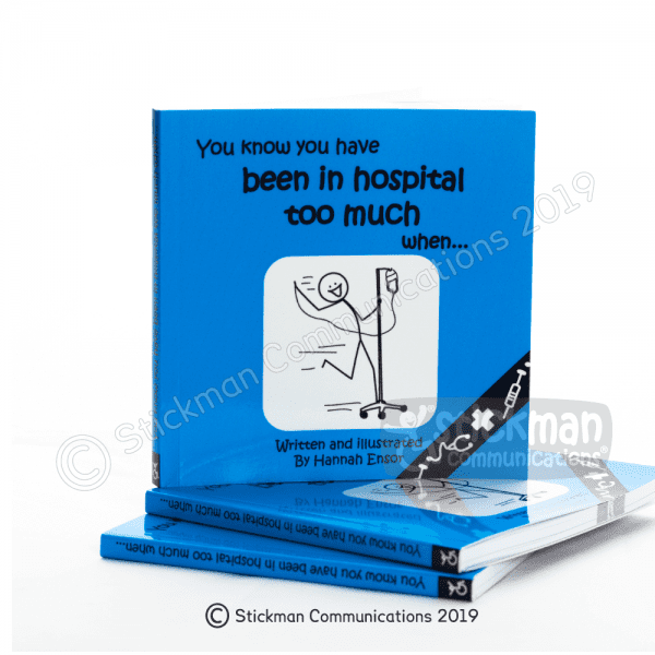 Image is a photograph of the front cover of the "You Know You Have Been in Hospital Too Much When..." book, featuring an illustration of a smiling stickman riding along on a IV drip strand