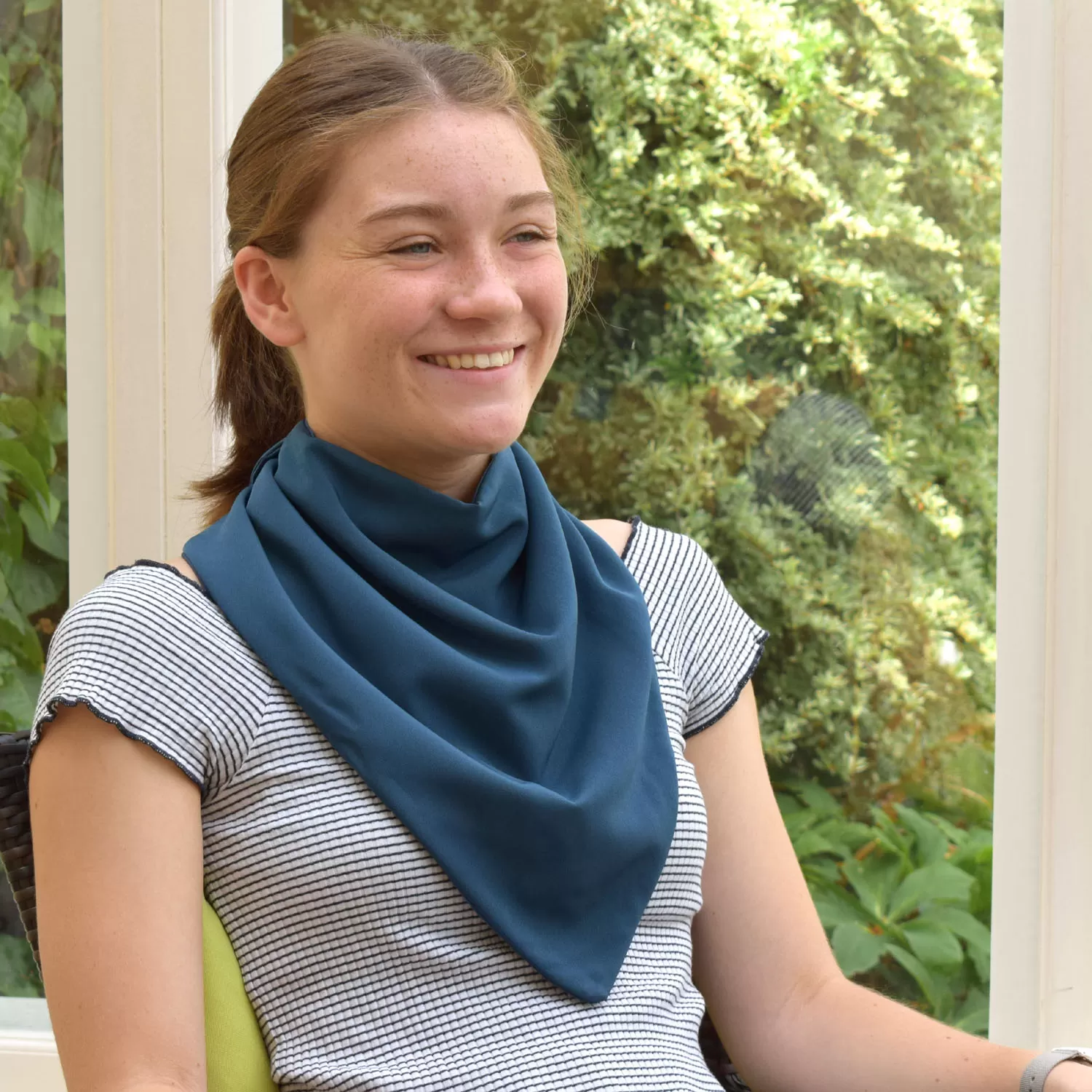 girl smiling wearing the long adult neckerchief in steel blue