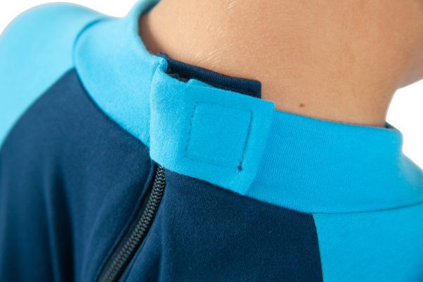 Hidden zip fastening on the back of Seenin children's turquoise and navy sleepsuit