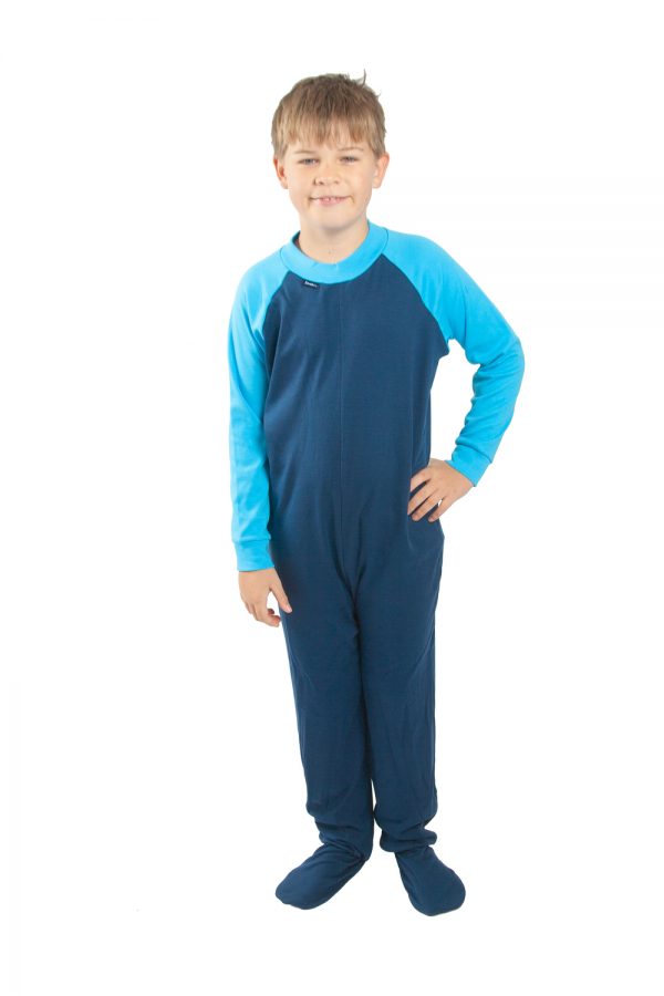 Young boy standing wearing Seenin children's turquoise and navy zip sleepsuit