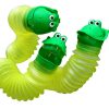 Image is a photograph of 3 Happy Pees expanded and twisted to show the flexible, concertina shape