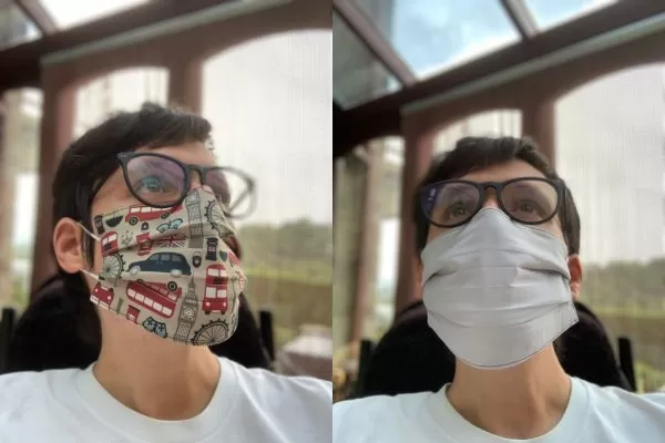 Image is two photographs side-by-side, of a man wearing a London-themed fabric face mask. In the first photograph his head is turned slightly to the right to show the design and fit of the mask. The fabric's design features London buses, black cabs, Big Ben and other iconic London imagery. In the second image the man is facing the camera but looking upwards slightly, and he is wearing the mask inside-out to illustrate that the inner lining is white in colour.