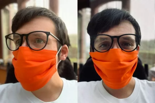 Image is two photographs side-by-side, of a man wearing an bright "Marigold" orange-coloured fabric face mask. In the first photograph the man is looking to the left and in the second photograph the man is facing the camera.