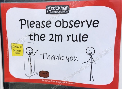 Stickman Communication sign saying please observe the 2m rule