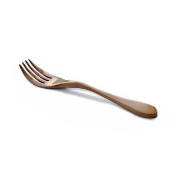 Image is a photograph of a Knork knife and fork in one, with a titanium coated Antique Copper finish