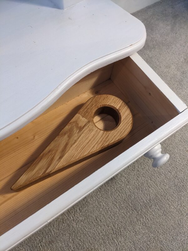 bed wedge in a drawer showing how this bed aid looks in a bedroom and is not ugly or stigmatising