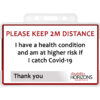 Image is a plastic ID card to promote social distancing, in a plastic ID card holder. Bright red text in capitals reads: "PLEASE KEEP 2M DISTANCE". Under this black text reads: "I have a health condition and am at higher risk if I catch Covid-19. Thank you". The bottom righthand corner features the Disability Horizons logo.