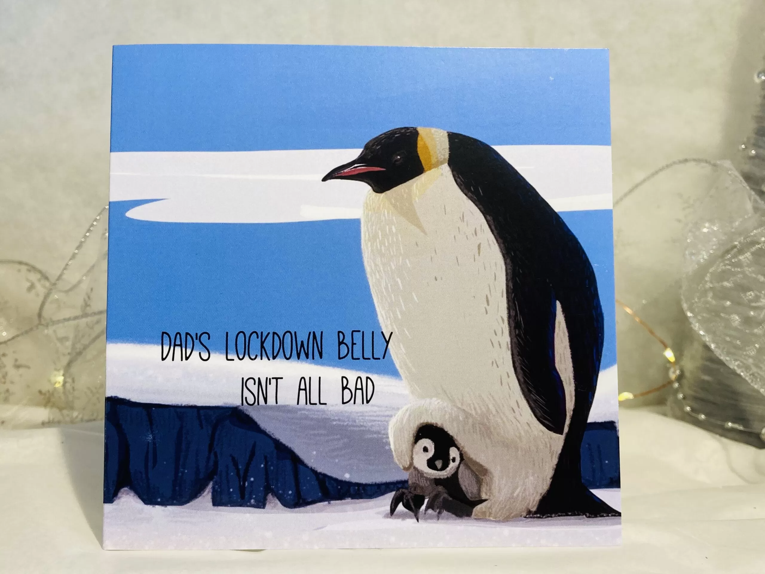 Daddy penguin and baby penquin with caption "Dad@s lockdown belly isn't all bad"