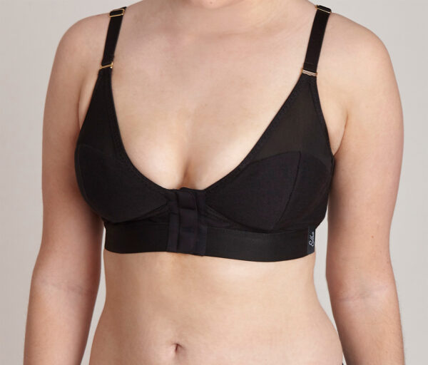 Image is a front view of a lady wearing an Elba London front-fastening, magnetic, adaptive bra in black