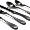 Image is a photograph of a 5 piece set of Matt black Knork cutlery on a white background, including Knork/fork, salad Knork/fork, knife, spoon and teaspoon