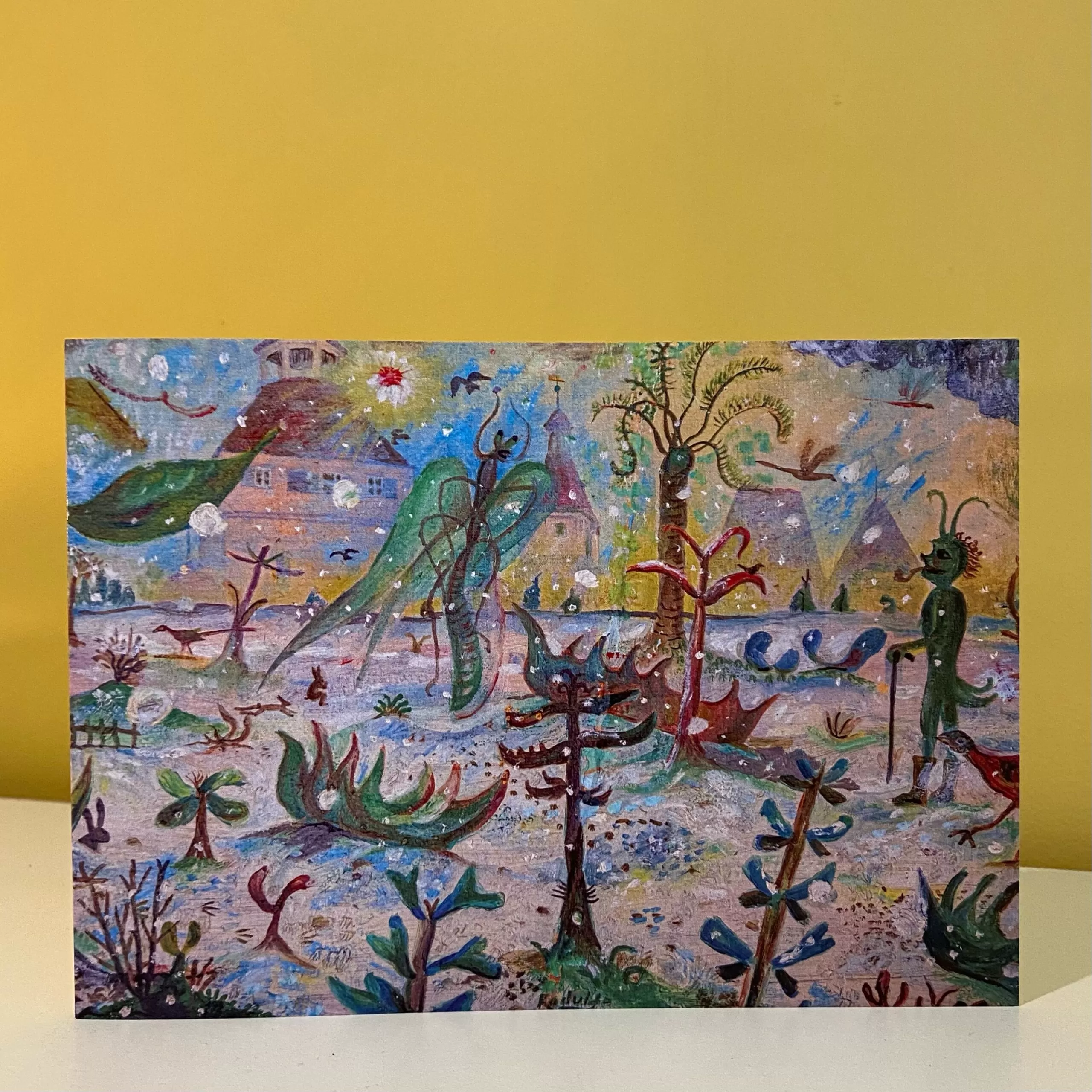 Image is a photograph of a Peter Rodulfo christmas card entitled "Xmas Elf" featuring psychedelic creatures and plant-life in a snowy setting.