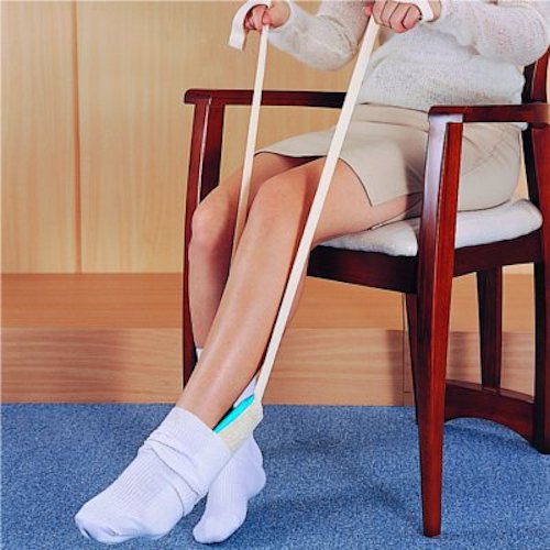 Buckingham delux sock aid being used by a woman sat on a chair