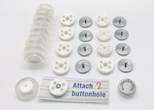 Buttons 2 Button adaptive magnetic buttons laid in rows on a white background