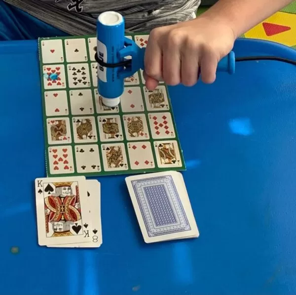 functionalhand being used to hold the marker in bingo.