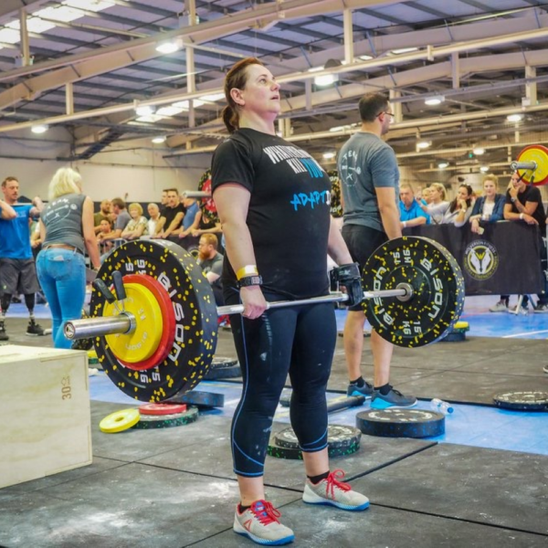 The limb difference aid being used to weightlift at the battle of britain throwdown.
