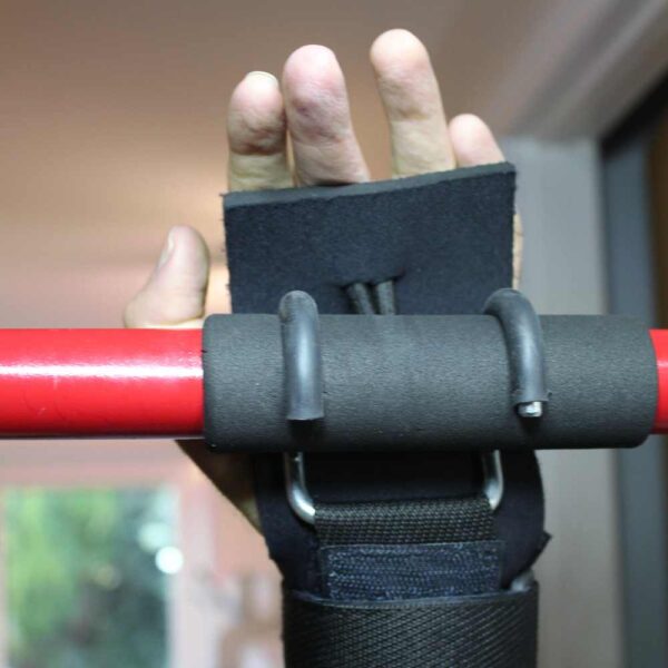 Hook aid being used to grip an exercise bar