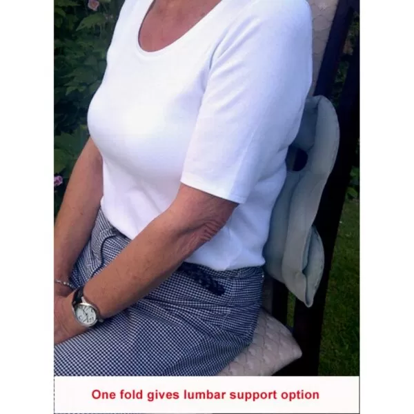 women using the cushion as a upper back support on a chair "one fold gives lumbar support option"