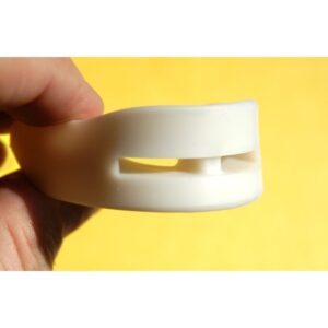image showing the snoringone snoring aid in front of a yellow background