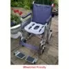 cushion used as support on a blue wheelchair "wheelchair friendly"