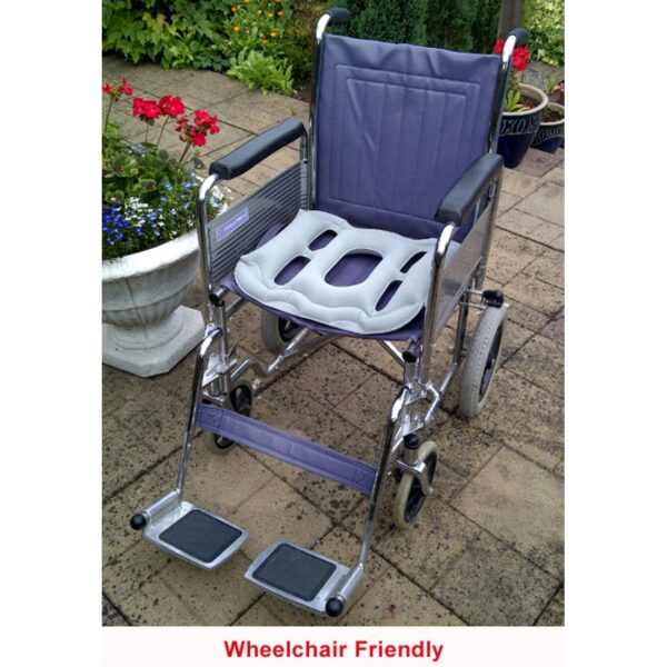 cushion used as support on a blue wheelchair "wheelchair friendly"
