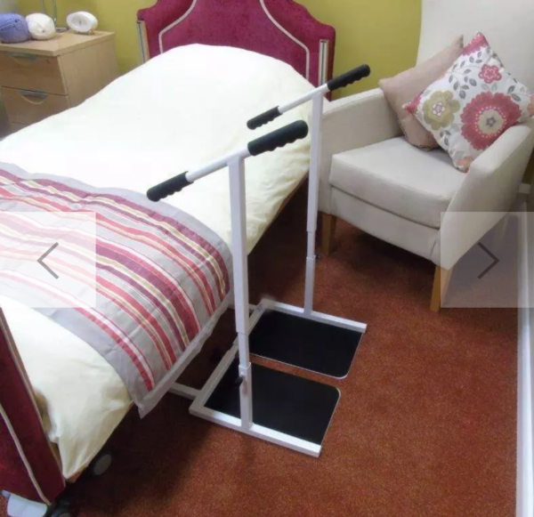 standeasy standing frame next to a bed