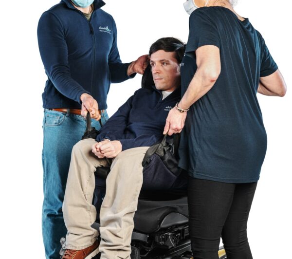 ablemove founder josh being lifted into his wheelchair with the ablesling