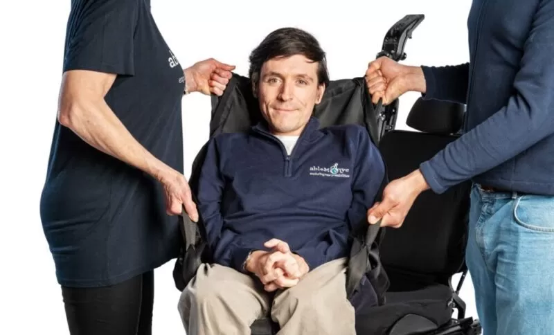 Able Move founder Josh being lifted in his able Sling