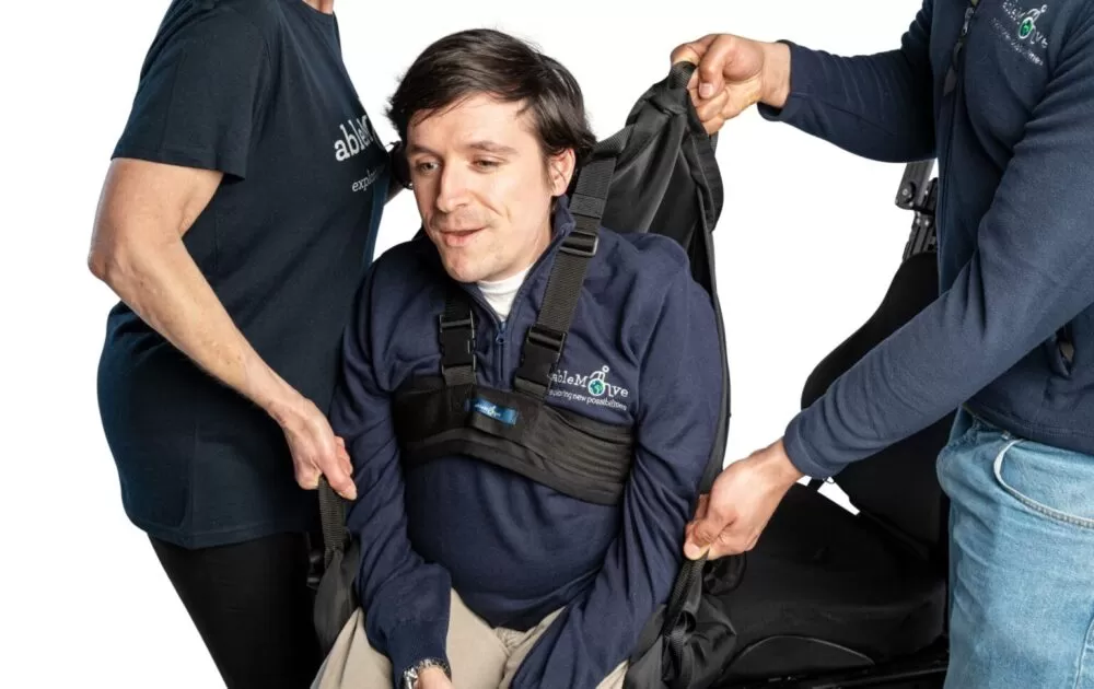 ablemove founder josh being secured to his ablesling with the ableharness