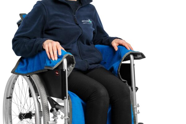 a man sitting in the manual wheelchair with the abledry cover