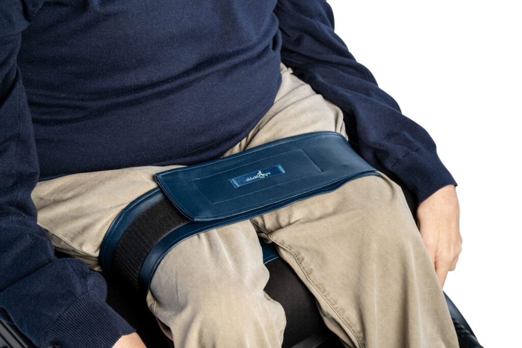 ableStrap wheelchair leg straps around a mans thigh area