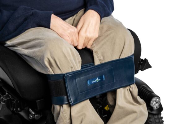 The ablestrap fastened to the lower legs showing how straps to hold legs together in wheelchair