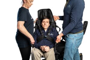 Able Move founder Josh sitting in the able Sling lite using a able Sling harness