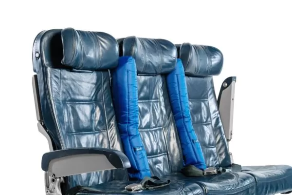 the padded arm rests on an air plane seat
