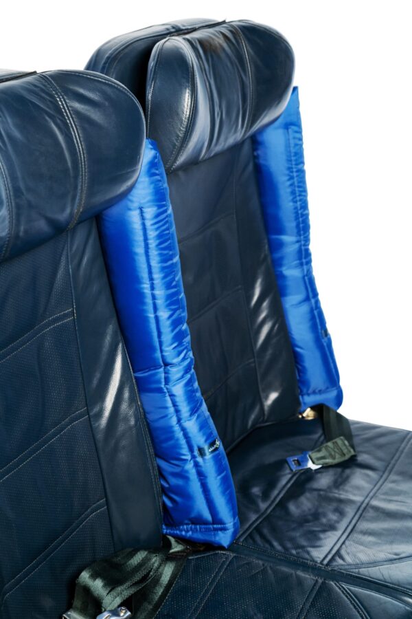 another shot of the air plane seat with the blue padded arm rests on