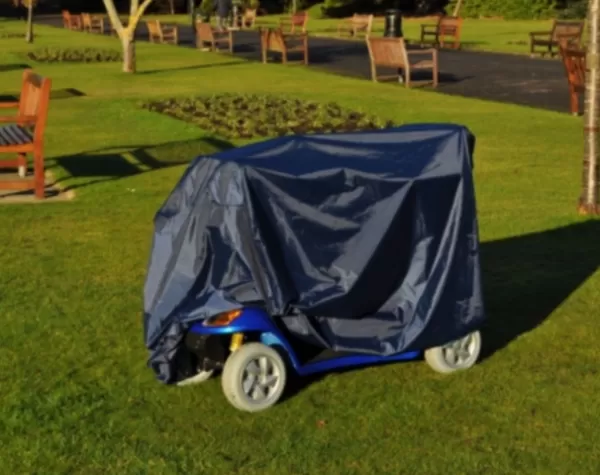 the splash scooter cover in use on a 4 wheeled scooter