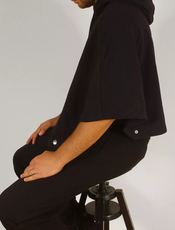 the unisex l able in navy side on showing its wider sleeves