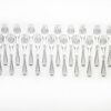 The 24 piece clear knok plasticware set sat out in a line