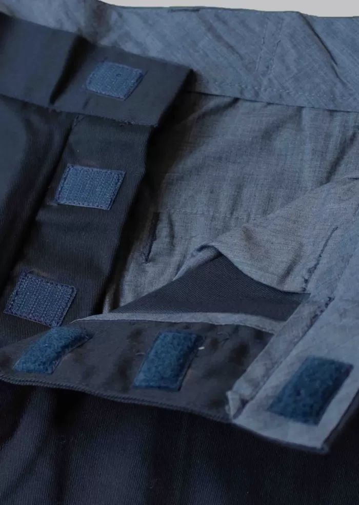 velcro fastenings on the navy chinos