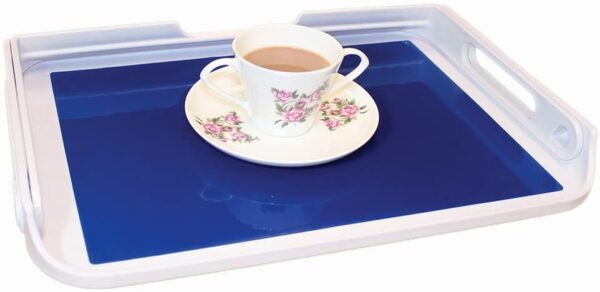 wide angle of the cup of tea and saucer on the middle of the tray