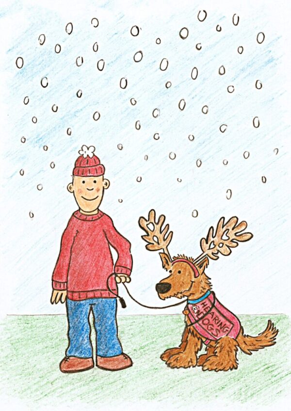 fin and his assitance dog in the snow disabled people's voice card. shows a boy in a red winter hat standing with his assistance dog in the snow. his assitance dog has a reindeer hat on