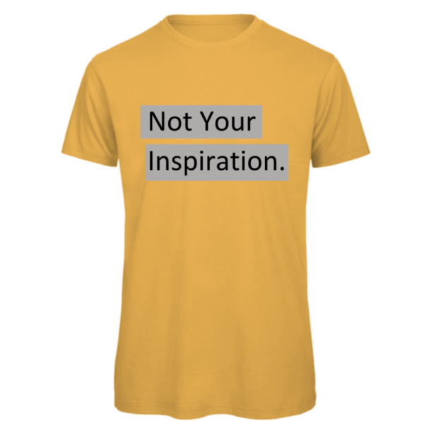 Not your inspiration t-shirt in gold. Reads:" Not your inspiration." in a black text with a grey background to the text