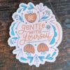 be gentle with yourself sticker on a wooden table