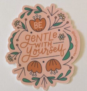 be gentle with yourself sticker on a white table