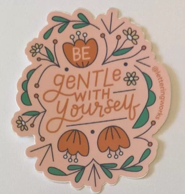 be gentle with yourself sticker on a white table